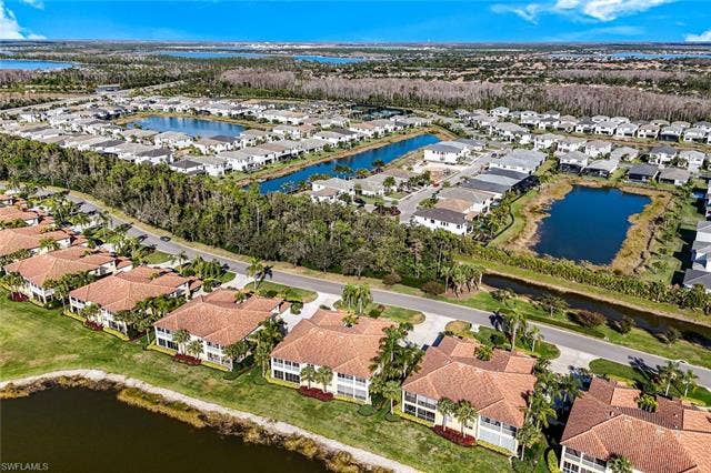 20667 Wildcat Run Dr, #101, Estero, FL 33928 Aerial perspective of suburban area featuring a large body of water