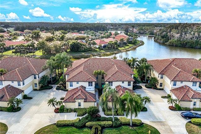 20667 Wildcat Run Dr, #101, Estero, FL 33928 Aerial perspective of suburban area with a nearby body of water