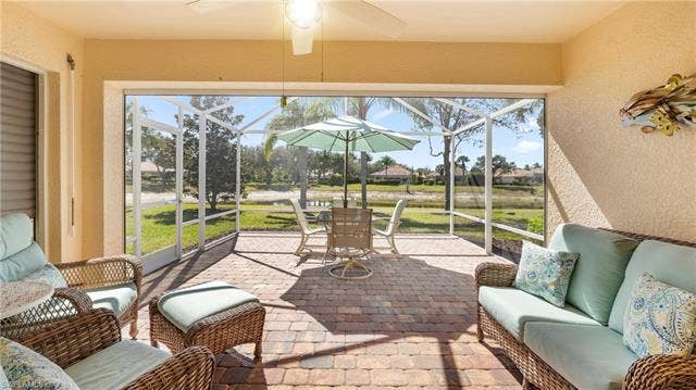 15127 Reef Ln, Bonita Springs, FL 34135 Extended lanai with waterfront view.