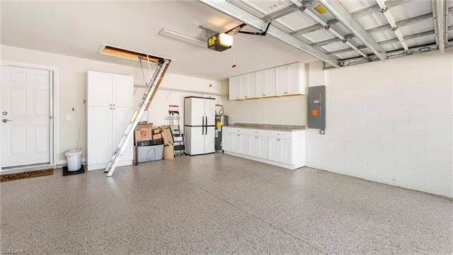 15127 Reef Ln, Bonita Springs, FL 34135 Extra wide garage with epoxy flooring