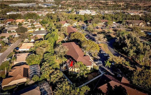 3160 Seasons Way, #709, Estero, FL 33928 Aerial view of property and surrounding area with nearby suburban area