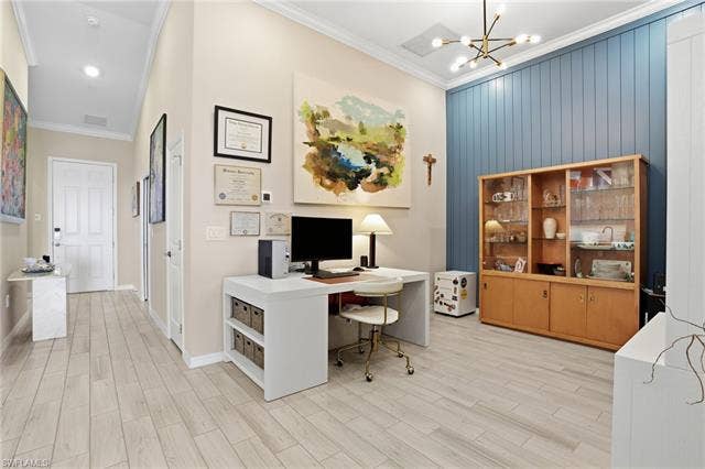 11861 Venetian Lagoon Dr, #203, Fort Myers, FL 33913 Office featuring crown molding, wood finish floors, and suspended lighting