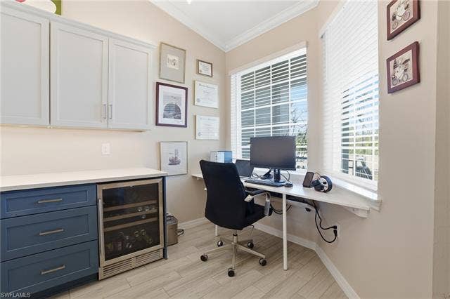 11861 Venetian Lagoon Dr, #203, Fort Myers, FL 33913 Office space featuring crown molding, beverage cooler, and wood finish floors
