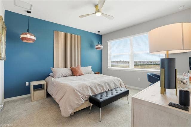 11861 Venetian Lagoon Dr, #203, Fort Myers, FL 33913 Bedroom featuring light carpet and ceiling fan