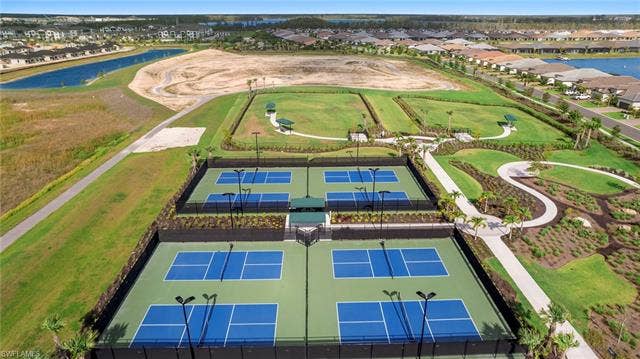 11861 Venetian Lagoon Dr, #203, Fort Myers, FL 33913 Aerial view of residential area featuring a large body of water