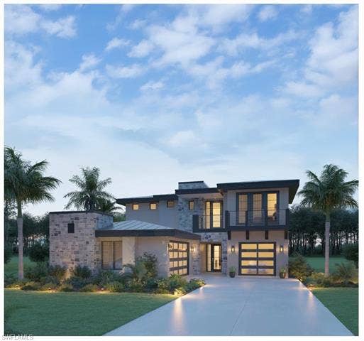 19090 Via Messina Way, Miromar Lakes, FL 33913 Contemporary house featuring stone siding, concrete driveway, an attached garage, a balcony, and stucco siding