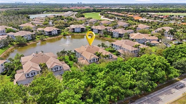 19620 Marino Lake Cir, #2802, Miromar Lakes, FL 33913 Aerial perspective of suburban area featuring a large body of water