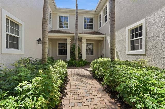 19620 Marino Lake Cir, #2802, Miromar Lakes, FL 33913 View of exterior entry featuring stucco siding