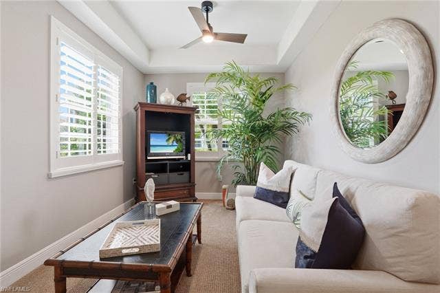 19620 Marino Lake Cir, #2802, Miromar Lakes, FL 33913 Carpeted living area featuring a raised ceiling and ceiling fan