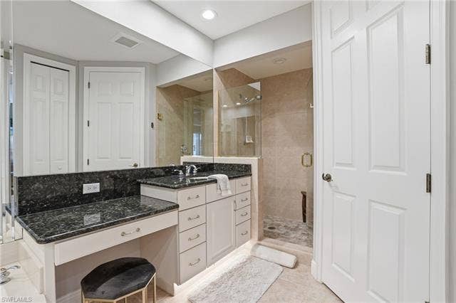 19620 Marino Lake Cir, #2802, Miromar Lakes, FL 33913 Full bath with vanity, a closet, a stall shower, and light tile patterned floors