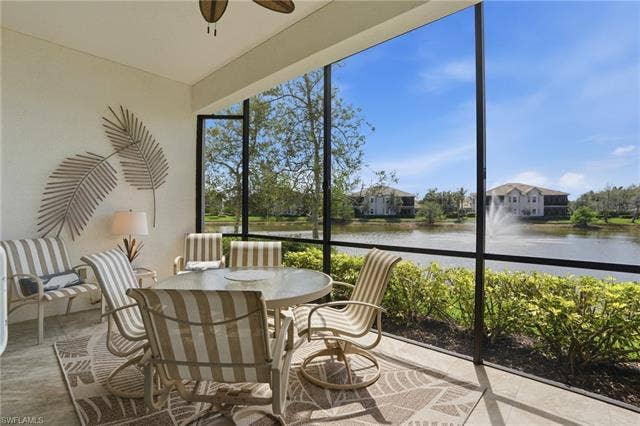 19620 Marino Lake Cir, #2802, Miromar Lakes, FL 33913 Sunroom / solarium with a water view, outdoor dining space, and ceiling fan