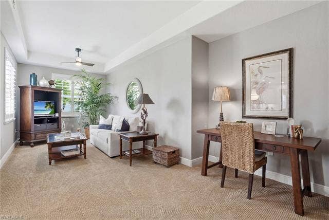 19620 Marino Lake Cir, #2802, Miromar Lakes, FL 33913 Living room with a raised ceiling, light colored carpet, and a ceiling fan