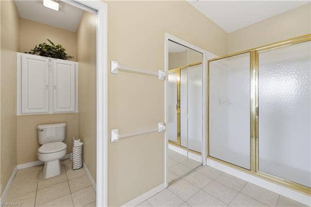 23541 Sandycreek Ter, #806, Estero, FL 34135 Full bathroom with a shower stall and light tile patterned floors