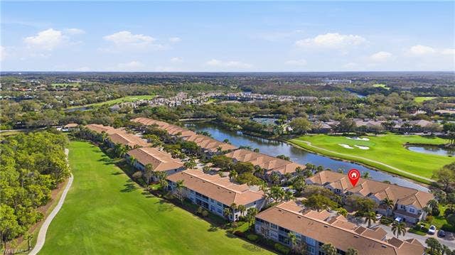 23541 Sandycreek Ter, #806, Estero, FL 34135 View of property location with a golf club, nearby suburban area, and a nearby body of water