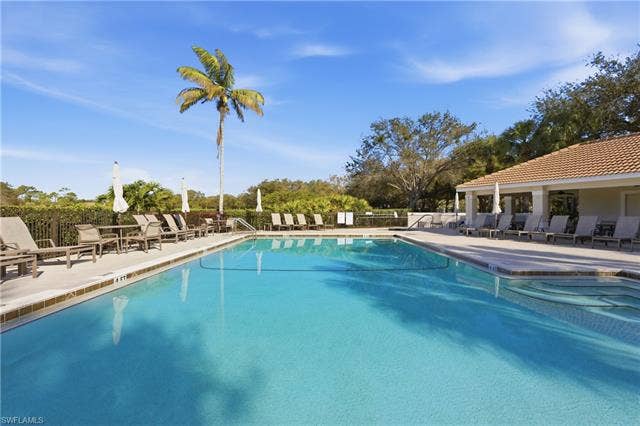 23541 Sandycreek Ter, #806, Estero, FL 34135 Community pool featuring a patio area