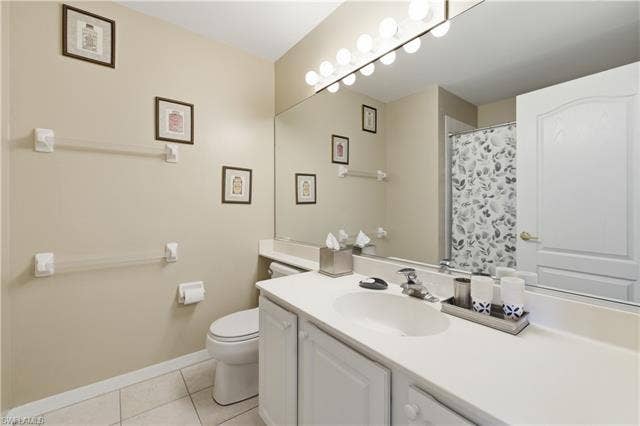 23541 Sandycreek Ter, #806, Estero, FL 34135 Full bath with vanity, a shower with shower curtain, and light tile patterned flooring