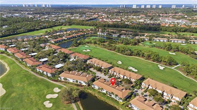 23541 Sandycreek Ter, #806, Estero, FL 34135 Aerial view of property's location featuring a large body of water and nearby suburban area
