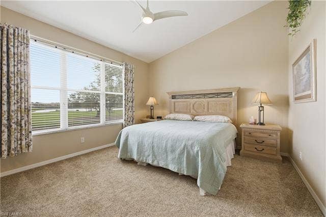 23541 Sandycreek Ter, #806, Estero, FL 34135 Bedroom with lofted ceiling, light carpet, and a ceiling fan