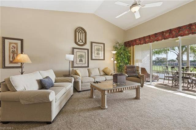 23541 Sandycreek Ter, #806, Estero, FL 34135 Carpeted living room featuring a ceiling fan and vaulted ceiling