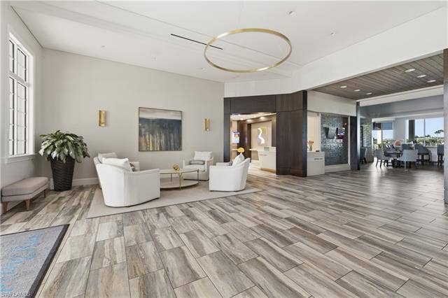 23541 Sandycreek Ter, #806, Estero, FL 34135 Living area featuring wood tiled floors