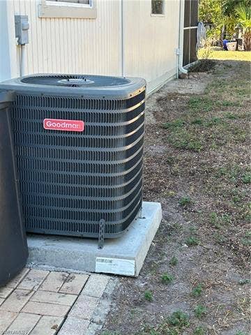 3323 Guilford Ct, Naples, FL 34112 AC bolted to hurricane pad