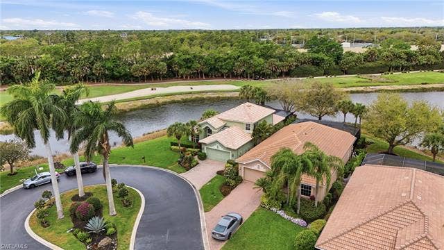 17801 Modena Rd, Miromar Lakes, FL 33913 Bird's eye view of a large body of water