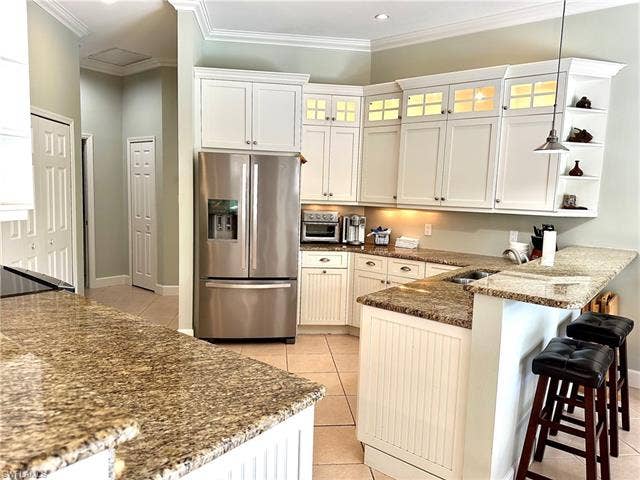 12654 Buttonbush Pl, Bonita Springs, FL 34135 The updated kitchen is modern and has lots of counter space.