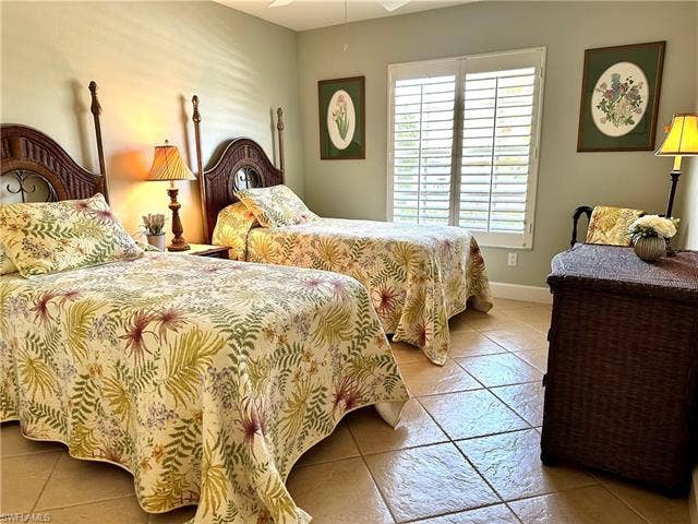 12654 Buttonbush Pl, Bonita Springs, FL 34135 Bedroom no. 3 is furnished with twin beds. It has an Island or Tommy Bahama vibe.
