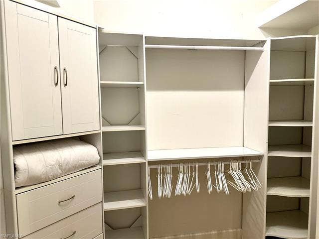 12654 Buttonbush Pl, Bonita Springs, FL 34135 This is a view of the center wall of the walk-in closet.