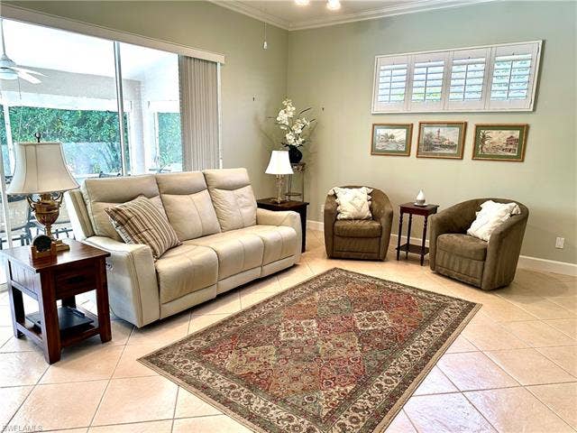 12654 Buttonbush Pl, Bonita Springs, FL 34135 The living room is spacious and has 12' of glass sliders. This gives a great expantion of space, when open to the patio area.