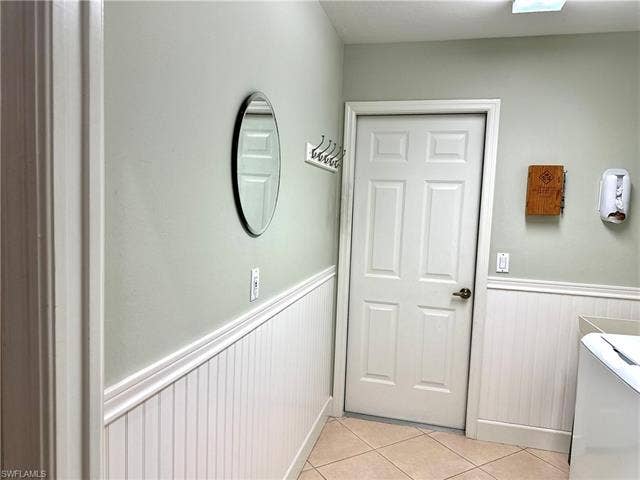 12654 Buttonbush Pl, Bonita Springs, FL 34135 The wainscoting gives the laundry room a fresh look, and provides a pleasant entry from the garage.