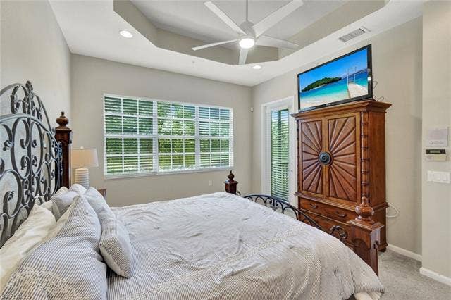 10060 Valiant Ct, #202, Miromar Lakes, FL 33913 Tray ceiling with recessed lighting and a ceiling fan