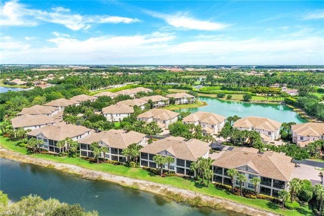 10060 Valiant Ct, #202, Miromar Lakes, FL 33913 Community of residences with screened balconies overlooking water features and mature landscaping