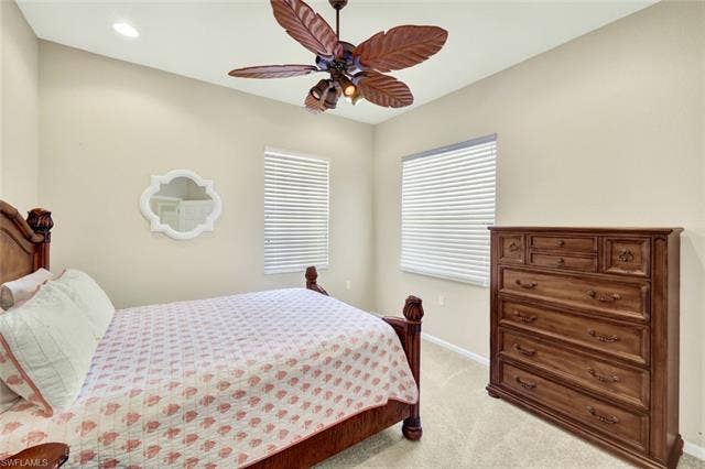 10060 Valiant Ct, #202, Miromar Lakes, FL 33913 Vaulted ceiling with recessed lighting and a ceiling fan featuring leaf-shaped blades