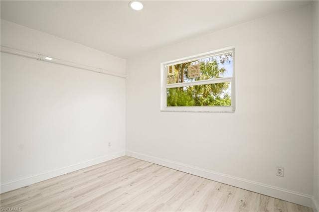 2316 Bayside St, Naples, FL 34112 Unfurnished room with light wood-style flooring and recessed lighting