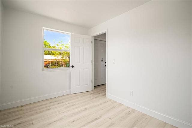 2316 Bayside St, Naples, FL 34112 Unfurnished bedroom with baseboards and light wood finished floors