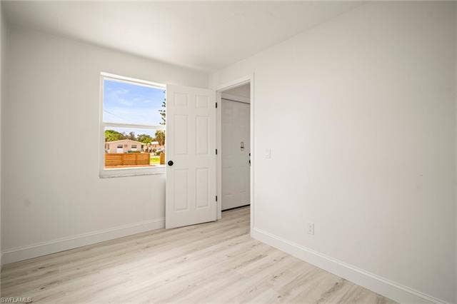 2316 Bayside St, Naples, FL 34112 Unfurnished room featuring baseboards and light wood finished floors