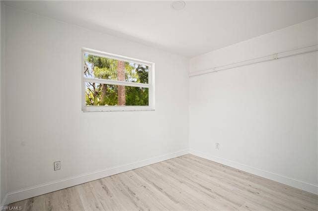2316 Bayside St, Naples, FL 34112 Unfurnished room with wood finished floors