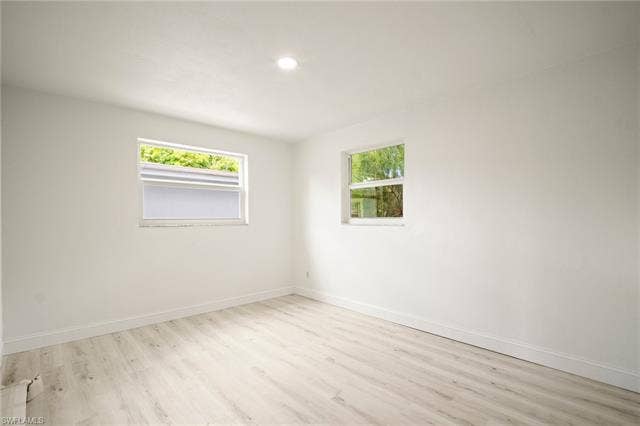 2316 Bayside St, Naples, FL 34112 Unfurnished room featuring wood finished floors, plenty of natural light, and recessed lighting