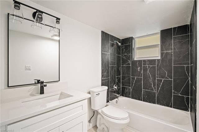2316 Bayside St, Naples, FL 34112 Full bathroom featuring shower combination and vanity