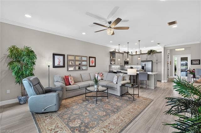 16459 Orinda Way, Bonita Springs, FL 34135 From lanai looking in towards kitchen...see the gorgeous plank tile flooring?!?