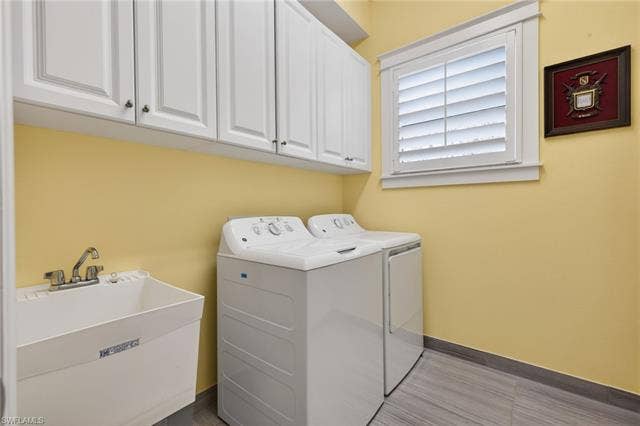 16459 Orinda Way, Bonita Springs, FL 34135 Lots of cabinets for storage and a laundry tub here!