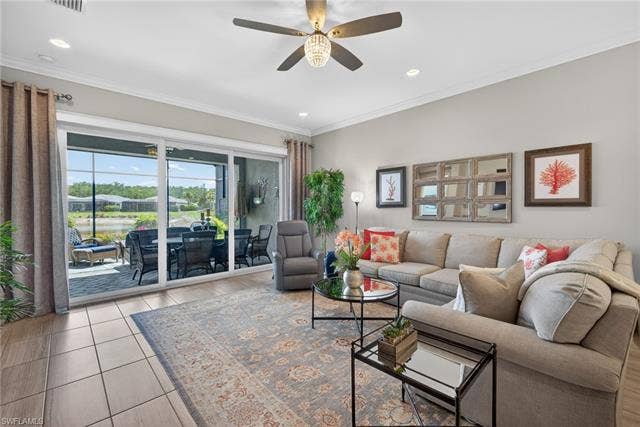 16459 Orinda Way, Bonita Springs, FL 34135 Great room opens off of kitchen and flows into THE maximum allowable expansion of lania for villas...and the cage was expanded as well!