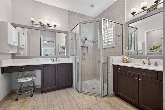 16459 Orinda Way, Bonita Springs, FL 34135 Vanity area, double vanities, corner shower and more of those gorgeous plank tile!