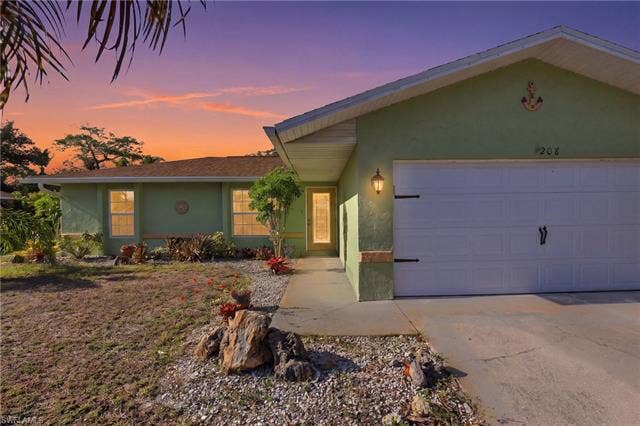 208 Aviation Pkwy, Cape Coral, FL 33904 Front of Home at Twilight