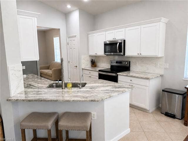 19081 Ridgepoint Dr, #201, Estero, FL 33928-3915 Virtually staged
