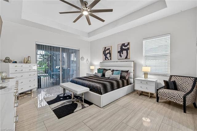 133 29th Ter, Cape Coral, FL 33904 Primary bedroom very spacious and opens to lanai and pool