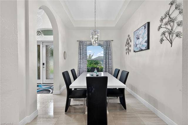 133 29th Ter, Cape Coral, FL 33904 Formal dining area open to living/kitchen area