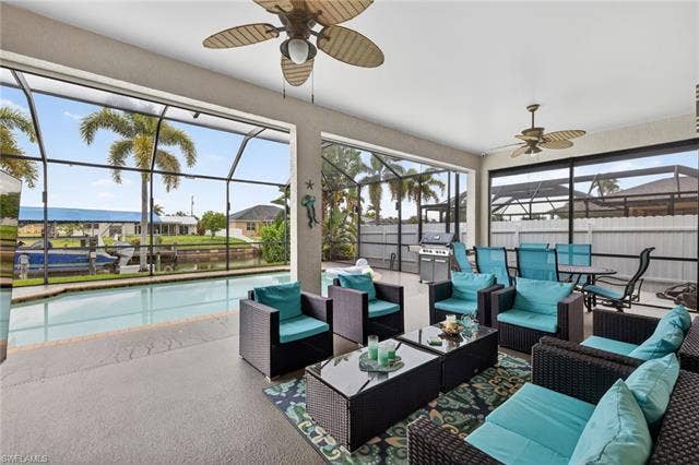 133 29th Ter, Cape Coral, FL 33904 Great seating area of lanai. Storm smart screen protects this area easy remote control