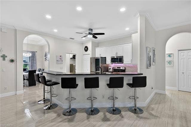 133 29th Ter, Cape Coral, FL 33904 Plenty of seating at the breakfast bar